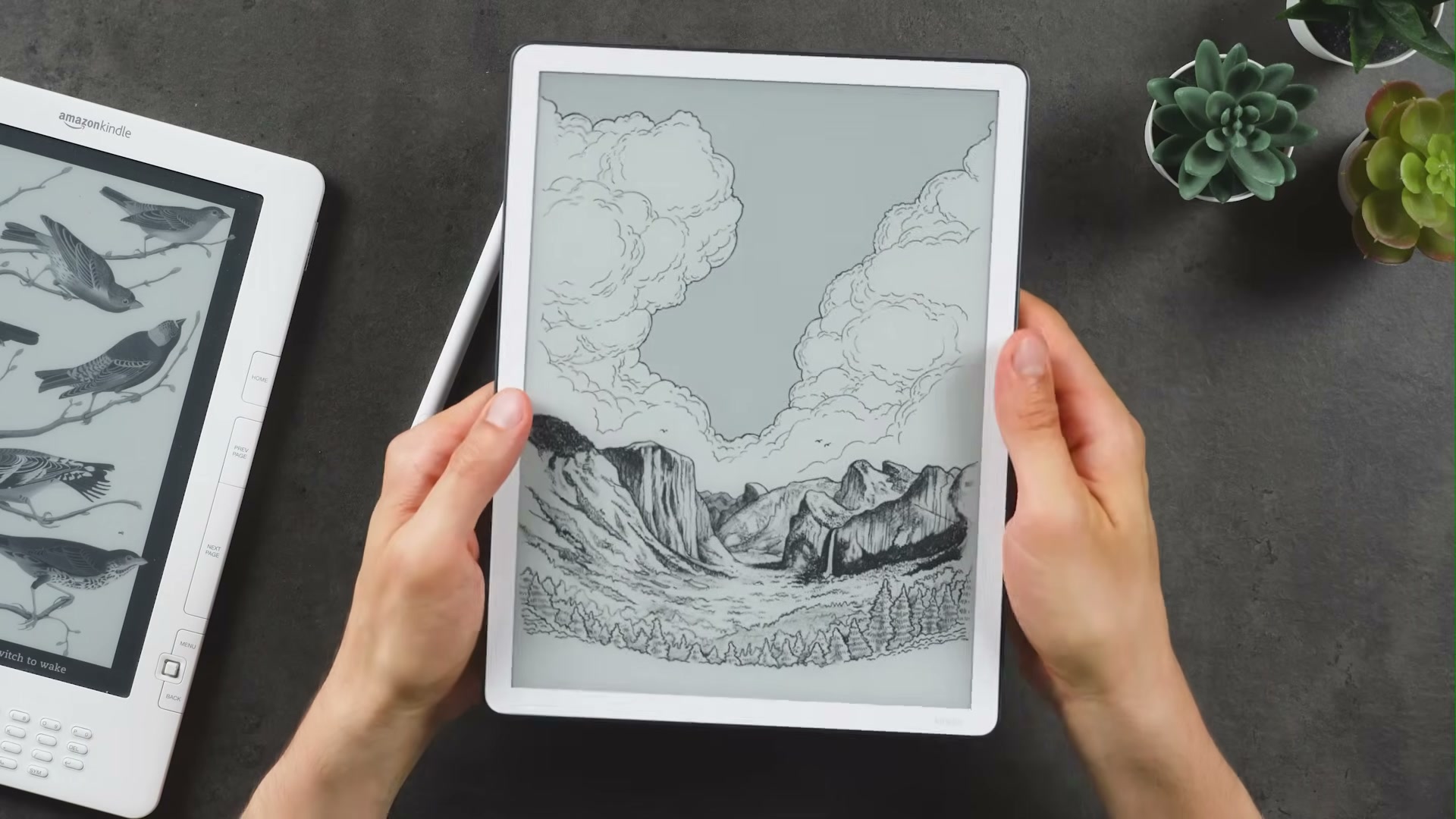 Kindle Scribe mit gleichmäßigem Rahmen und Landschaftsmotiv auf dem Display
